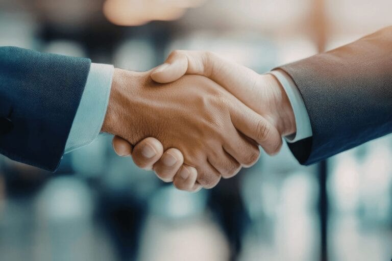 Rukovanje između dva poslovna partnera nakon uspješnog due diligence izvještaja i zaključenog M&A procesa